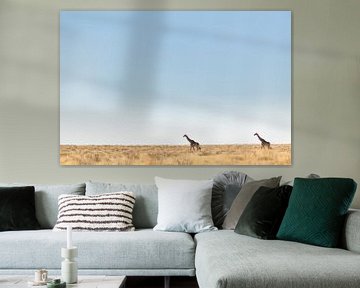 Empty desert landscape with two giraffes against the horizon by Simone Janssen