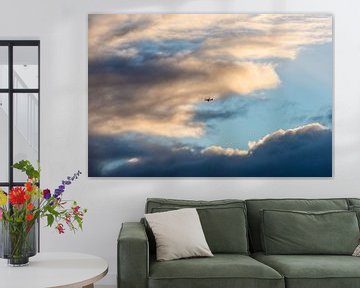 Wolken met vliegtuig by Brian Morgan