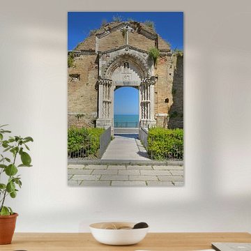 The historic portal of the ruins of the Church of San Pietro in Vasto, overlooking the blue sea by Tomherkules
