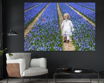 Little girl in Holland's flower field by Inge van den Brande