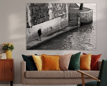 Lonely figure walking along the Seine by Mark Scheper