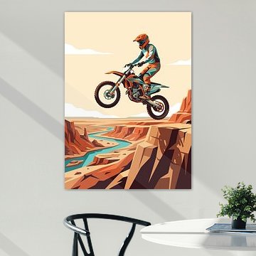 Motocross rider jumping over dramatic red rock canyon with winding river