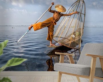 FISHERMAN AT SUNRISE vist ON TRADITIONAL WAY TO INLE LAKE IN MYANMAR. With a basket the fish is caug by Wout Kok