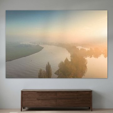 Sunrise over the river IJssel during a beautiful autumn morning