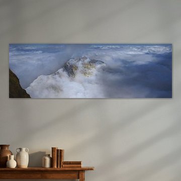 In the silent realm of the cloud-capped mountains