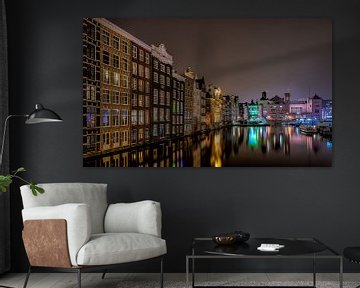 Damrak Amsterdam canal at night by Mario Calma