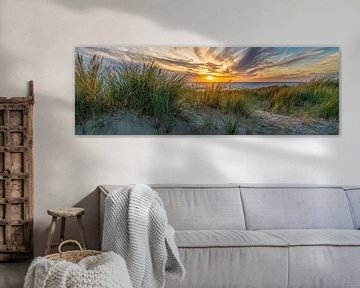 zonsondergang met de duinen en de Noordzee van eric van der eijk