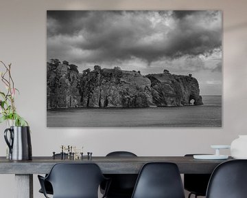 Rocky coast with threatening clouds by Bert Bouwmeester