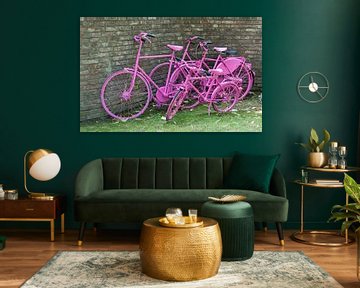 pink painted bikes and old wall by ChrisWillemsen