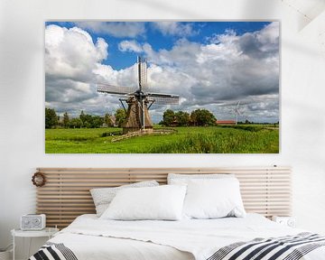 Poldermolen in een Hollands landschap by Bram van Broekhoven
