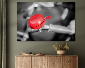 Red bicycle bell by Stewart Leiwakabessy