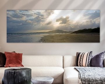 Zonnestralen op  strand by Jos van Ooij