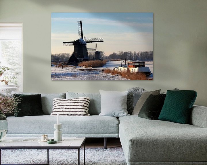 Sfeerimpressie: Hollandse oude windmolens in wintertafreel  van Paul Franke