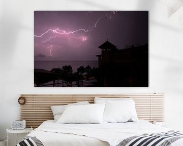 Thunder and Lightning on Madeira at night over the sea by Paul Franke