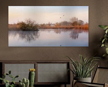 Verstild landschap met vliegende eenden van Evert Jan Kip