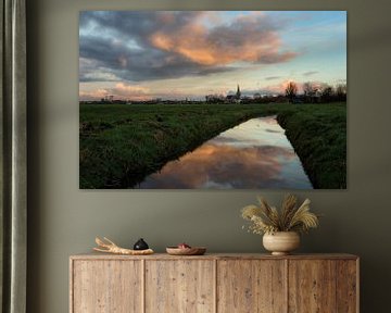 The town of IJlst in Friesland with a reflection of the sky in a ditch in the foreground One2expose  by Wout Kok