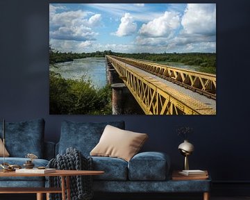 Old bridge with cloudy sky von Hans Vos Fotografie