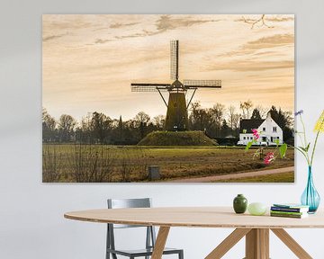 A Dutch Windmill with A yellow sky van Brian Morgan