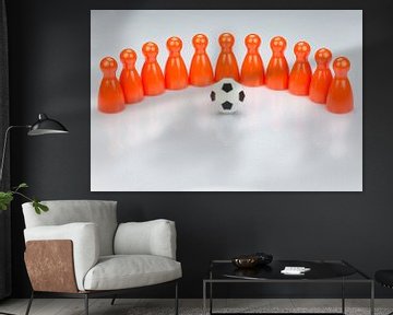 Conceptuele oranje speelpionnen als voetbalelftal