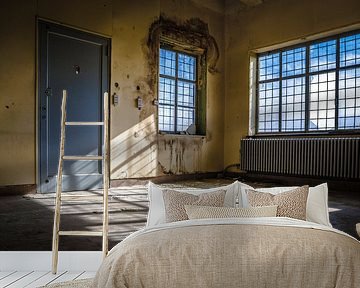 Light in an abandoned building by Steven Dijkshoorn