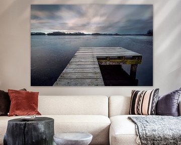 A jetty in a frozen lake von Peter Bolman