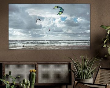 Kitesurfers in the surf of the North Sea by Paul Hemmen