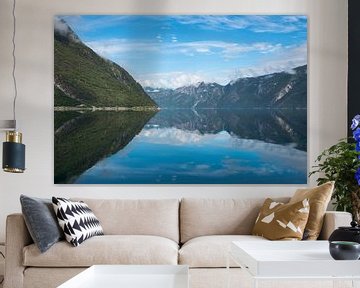 reflection of the mountains in fjord in norway