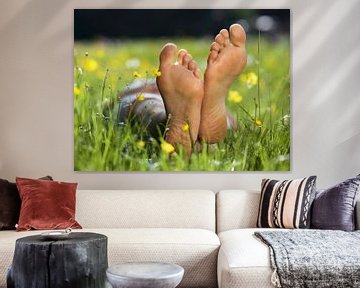 Soles of bare feet in flowerfield, close up by BeeldigBeeld Food & Lifestyle