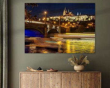 Prague castle in the evening with light stripes on the water by Christa Thieme-Krus