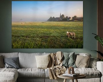 Hollands nevelig landschap met grazendeschapen en een typisch nederlandse wolkenlucht. Wout Kok One2 van Wout Kok