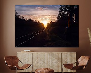 Sunset at the railroad by Robert de Jong
