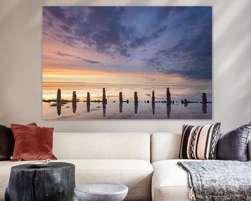 Poles @ Wadden Sea near Wierum during sunset by Martijn van Dellen