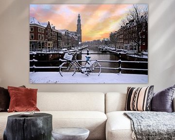 Amsterdam covered with snow with the Westerkerk in winter in the van Eye on You