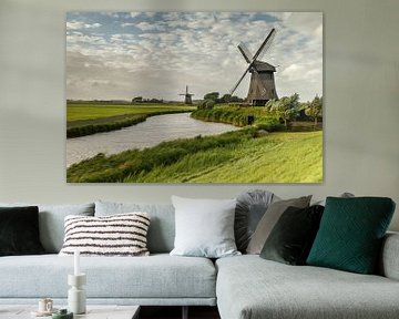 Typical Dutch Windmill in a polder  by Menno Schaefer