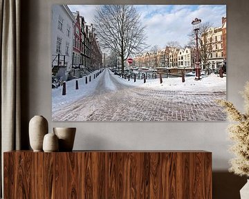 Besneeuwde straat in Amsterdam Nederland in de winter van Eye on You