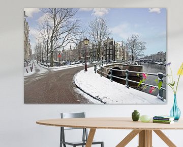 Besneeuwd Amsterdam in de winter in Nederland sur Eye on You
