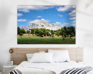 Puglia white city Ostuni with olive trees by iPics Photography