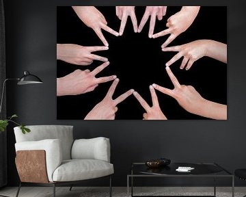 Ten hands of girls form a star isolated on black background sur Ben Schonewille