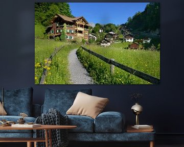 A beautiful wooden house in Tschagguns Montafon Austria on a sunny morning van Riekus Reinders