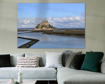 the Mont Saint-Michel with the blue sea in front and a cloudy sky in the background in summer by Angelique Nijssen