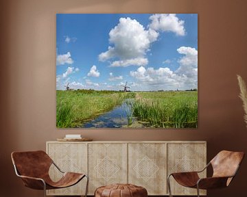 A ditch with two smock windmills by Rene van der Meer