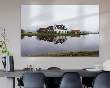 Dutch farmhouse at the side of a lake with reflection in the water near Amsterdam, the Netherlands by Leoniek van der Vliet