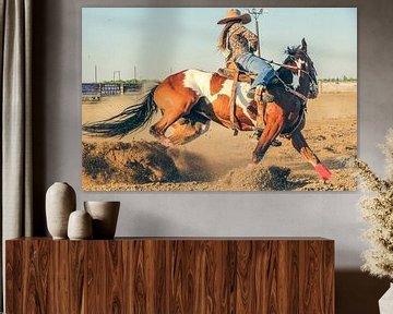 Cowgirl riding barrel racing with an energetic brown and white horse by Atelier Liesjes