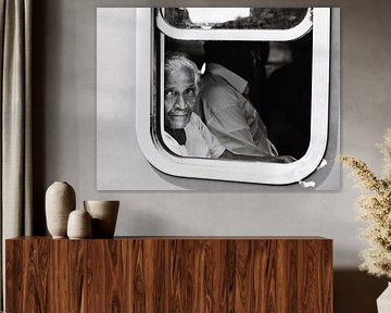 The beautiful Sri Lankan woman in a blue train by Rebecca Gruppen