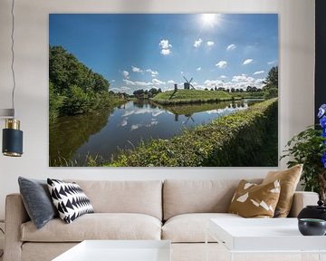 Bourtange Old Dutch Village wit a dike and a mill. by ProPhoto Pictures