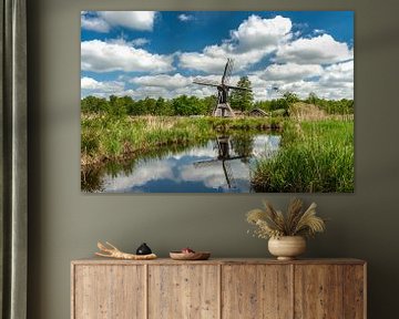 Hollandse wolkenluchten met een molen van Fotografiecor .nl