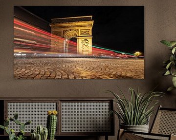 The lively lights around the Arc de Triomphe in Paris by Michel Geluk