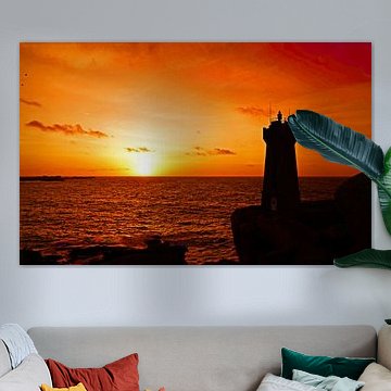 Men Ruz lighthouse on pink granite coast at sunset