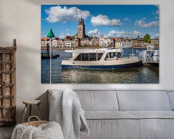 Ferry in river IJssel with skyline of Deventer, The Netherlands