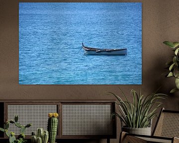 Rowing boat on calm sea by Tom Van Dyck